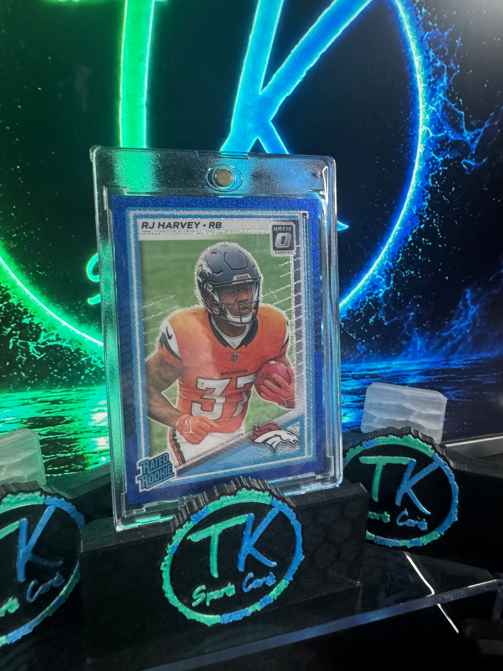 2025 Donruss Optic RJ Harvey Rated Rookie Blue Glitter SP #208 – Broncos