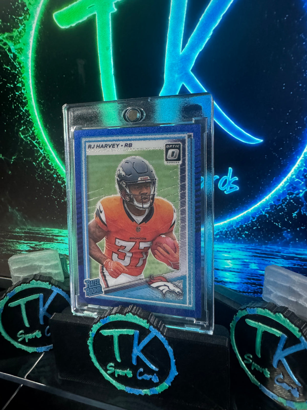 2025 Donruss Optic RJ Harvey Rated Rookie Blue Glitter SP #208 – Broncos
